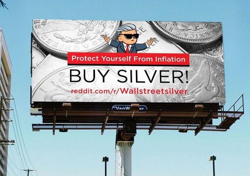 #Silversqueeze 2.0? Billboard showing the wall street silver guy from reddit with silver coins in the background and the sentences protect yourself from inflation buy silver reddit.com/r/Wallstreetsilver