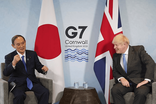 Weekly Digest: Fed's Tested Again, Busy Week for Bitcoin UK Prime Minister Boris Johnson and Japanese Prime Minister Yoshihide Suga attending a meeting on the sidelines of the G7 summit in Cornwall with the Japanese and British flags standing in the background.