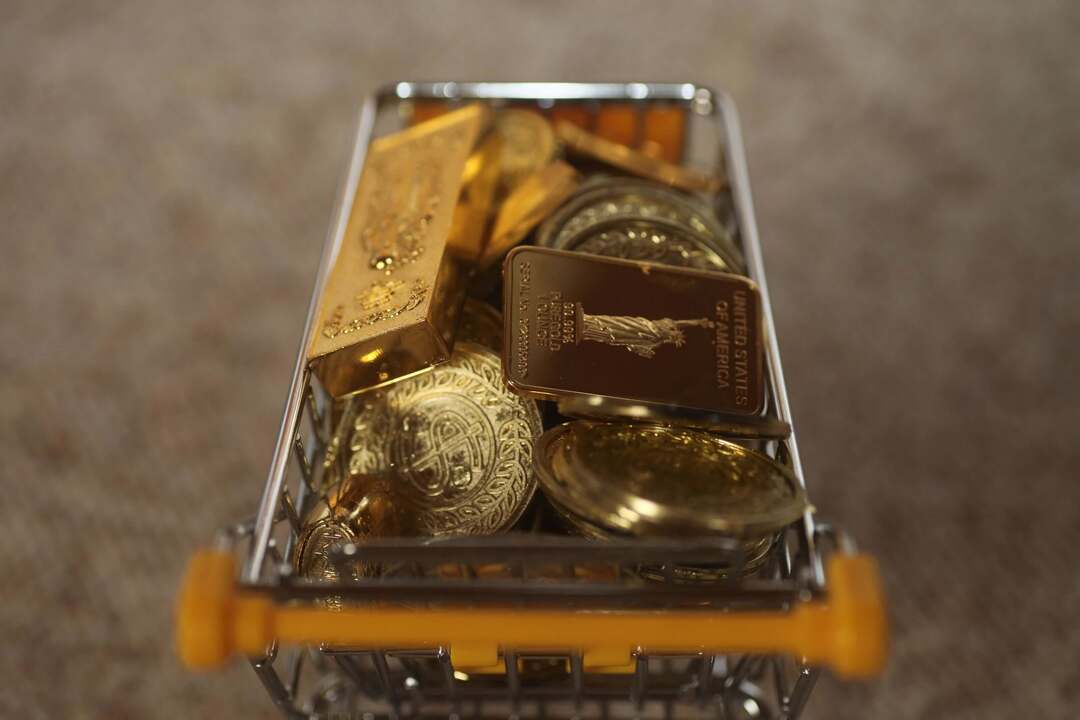 Where to Buy Physical Gold? physical gold coins and gold bars filling a shopping cart to represent investors buying gold