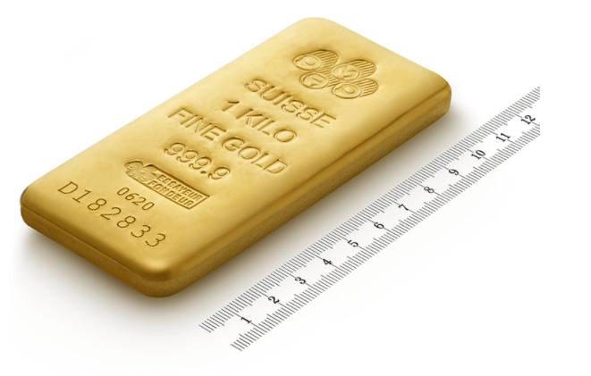 Un lingotto d’oro da 1 kg con un righello.