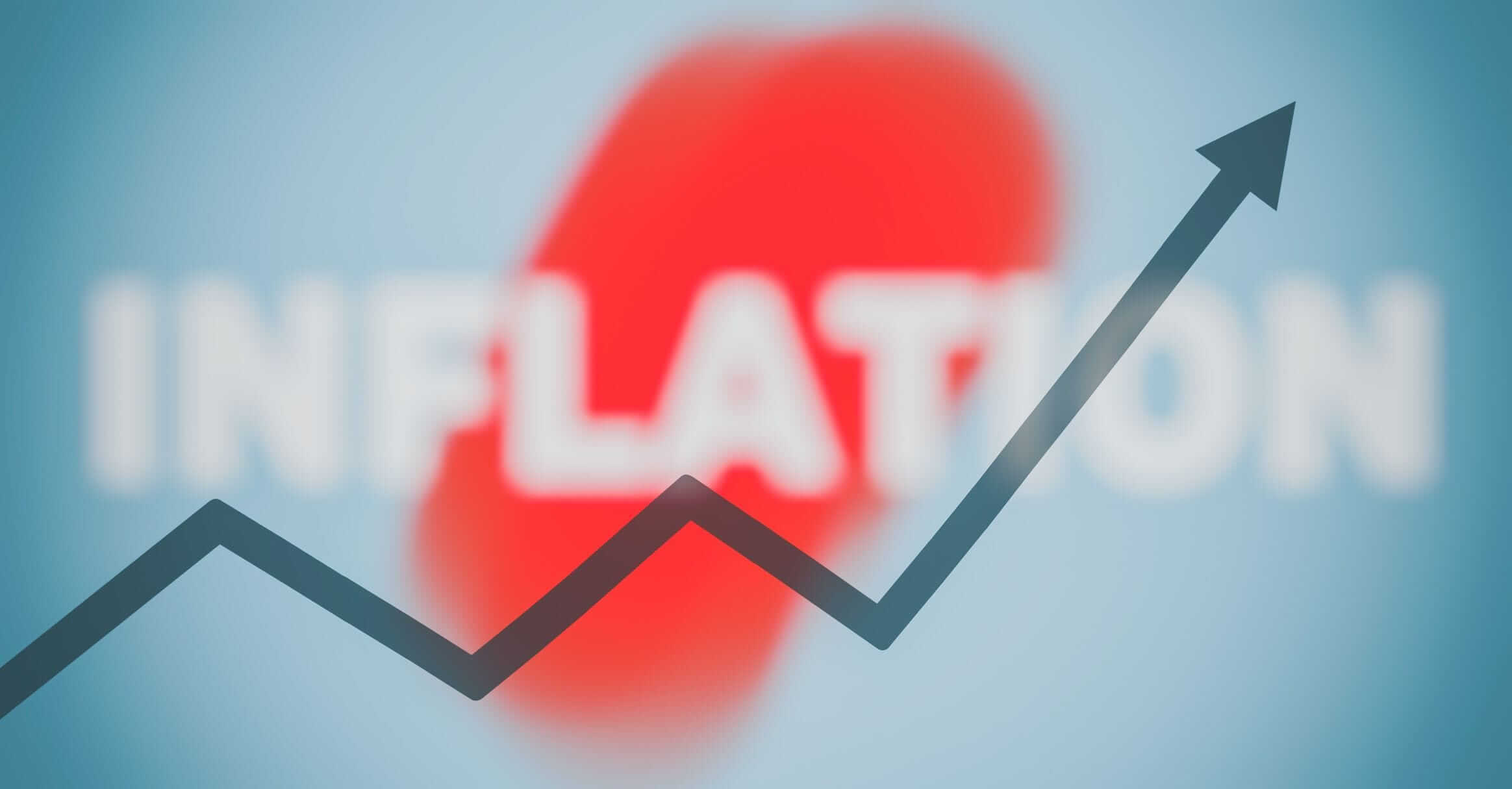 Un grafico che sale e scende con la scritta “inflation” (inflazione) sullo sfondo.