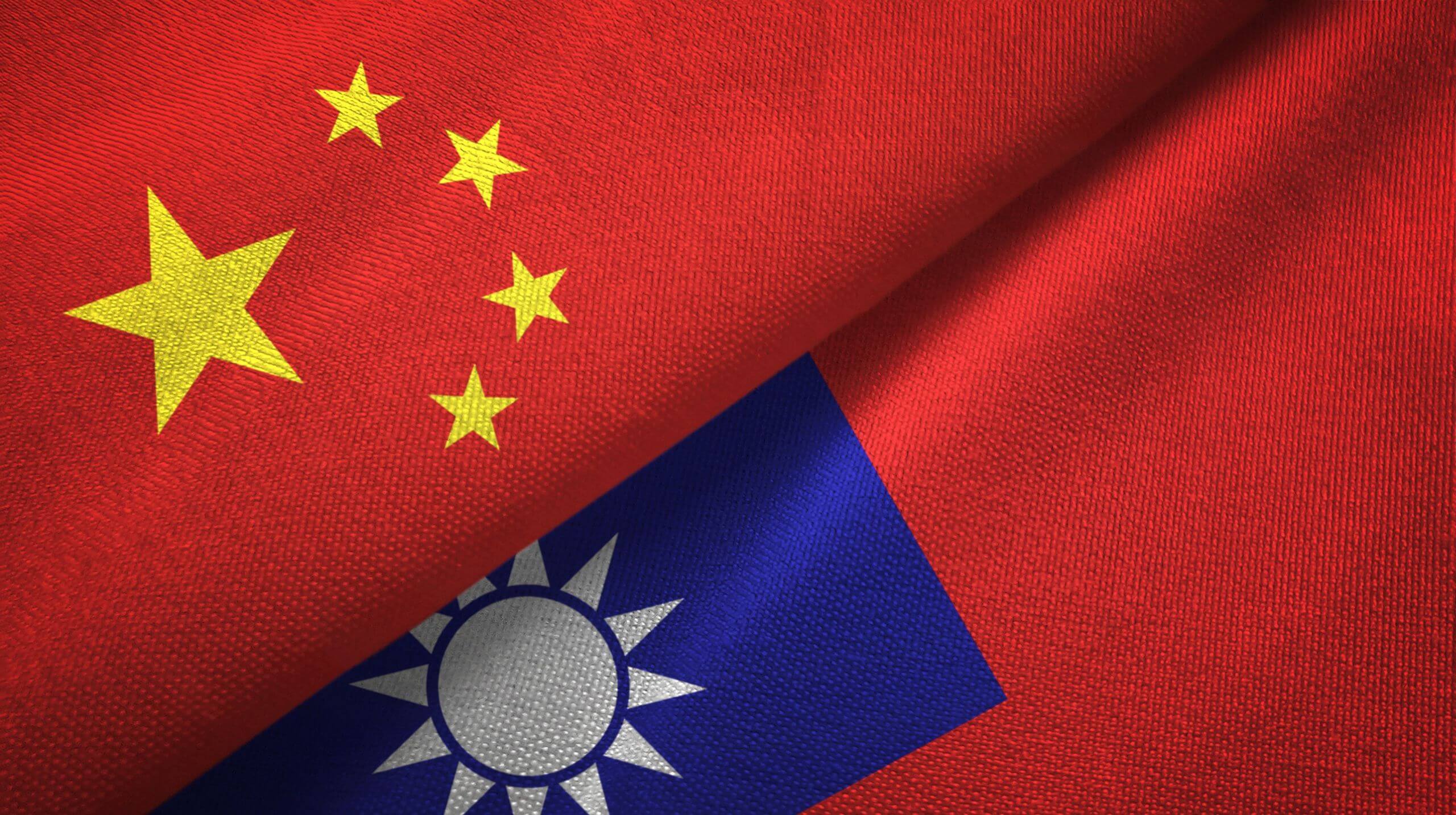 Overlapping Chinese and Taiwanese flags